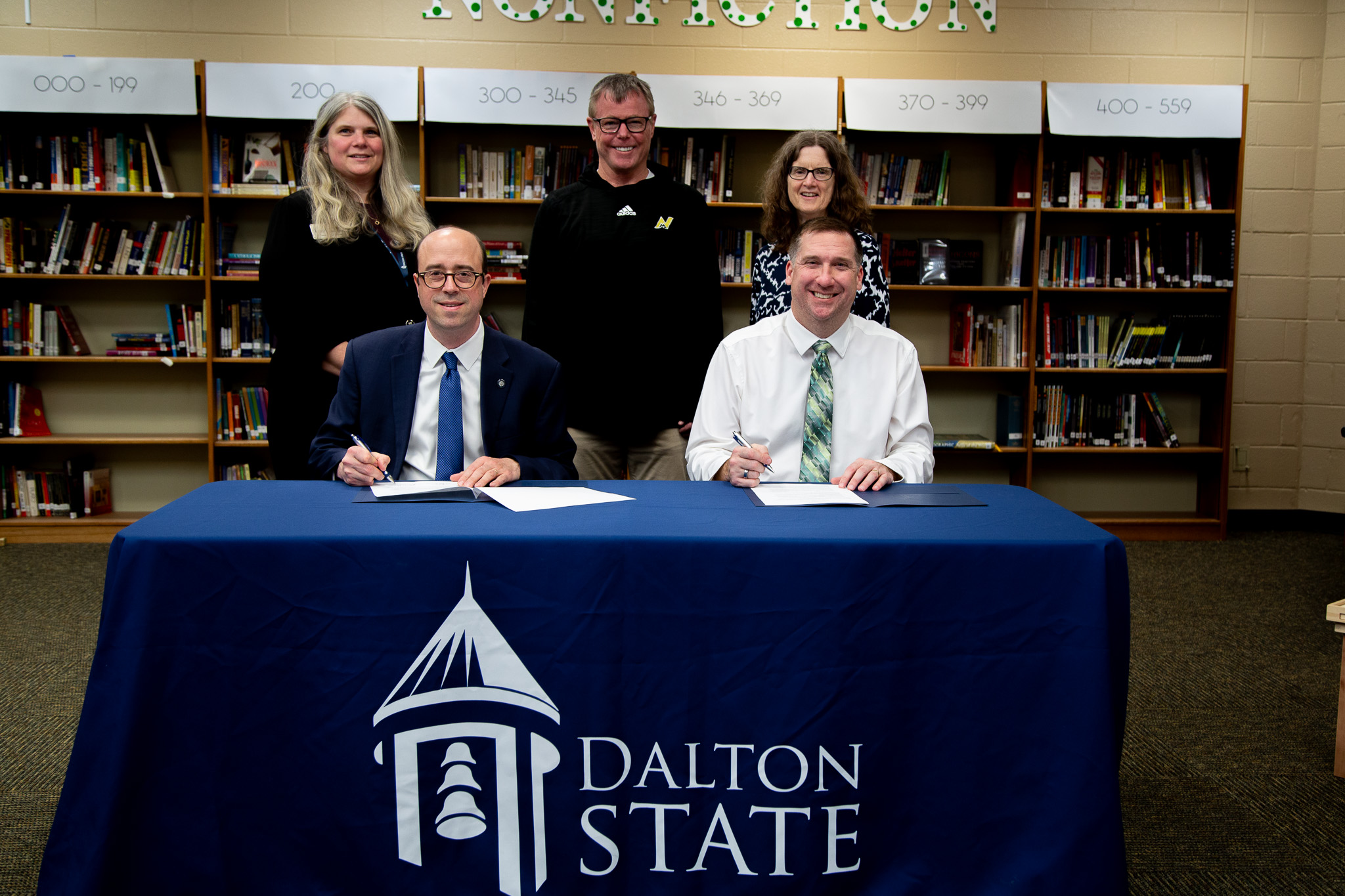 Dalton State College and Murray County Schools (MCS) have created a new partnership to enhance the region's teacher workforce pipeline. Dalton State President John Fuchko, seated at left, and MCS Superintendent Tim Wright, seated at right, signed the partnership agreement in a ceremony Feb. 25. Pictured standing from left are Gina Kertulis-Tartar, provost and vice president for academic affairs for Dalton State; Michael Tuck, MCS director of administration; and Sharon Hixon, dean of the Dalton State School of Education.